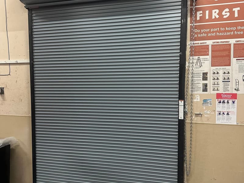 Dalton commercial rolling steel door interior view with safety signage