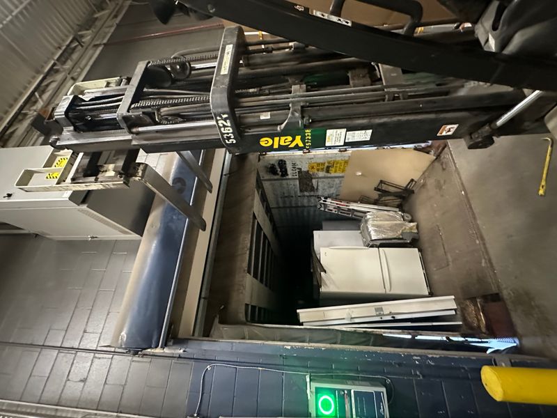 Commercial warehouse interior with Yale forklift and door components ready for install