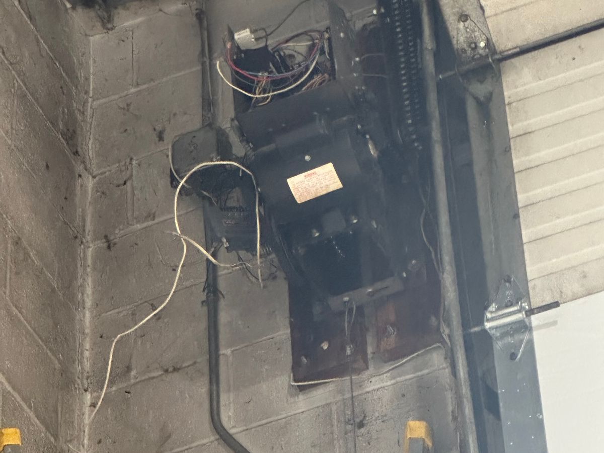 LiftMaster commercial opener and spring system installed on ceiling